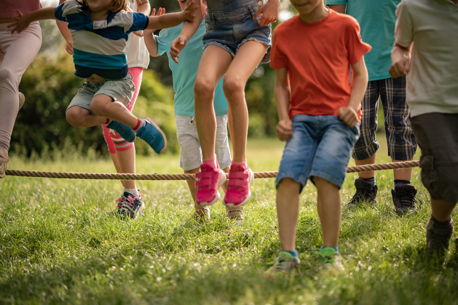 Kids jumping over a rope